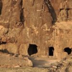 The image is of the Lohani Caves in Madhya Pradesh, featuring a large cave entrance.