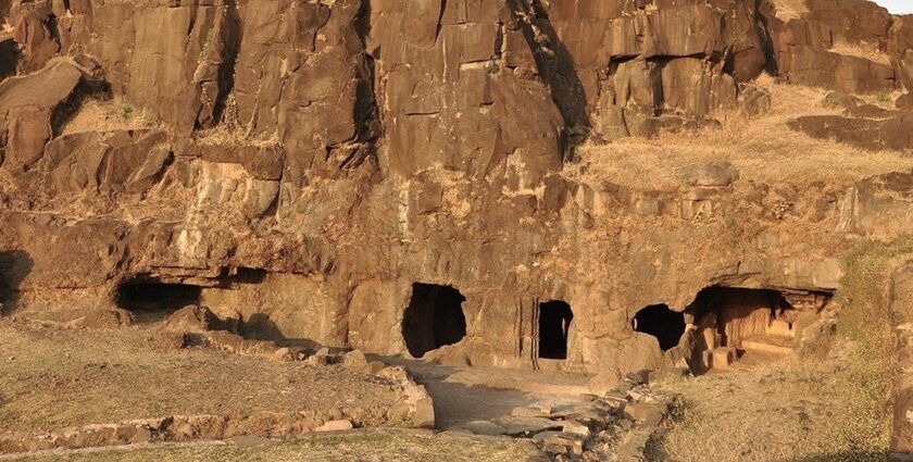 The image is of the Lohani Caves in Madhya Pradesh, featuring a large cave entrance.