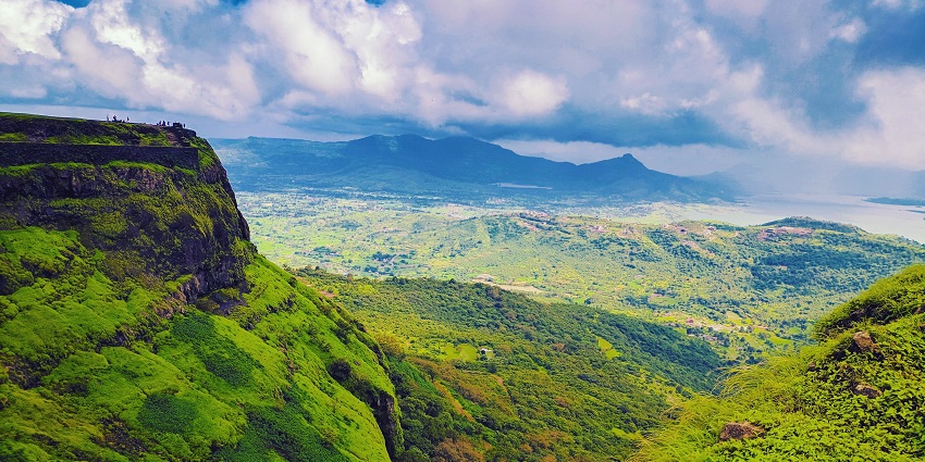 An image of Visapur Fort surrounded by lush greenery and mist in Lonavala, India.