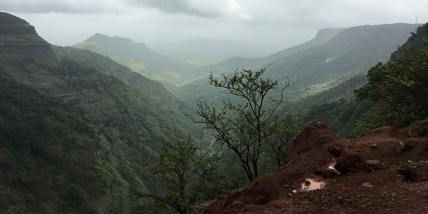 A narrow stream passing through the hills of Lonavala visible from another hilltop