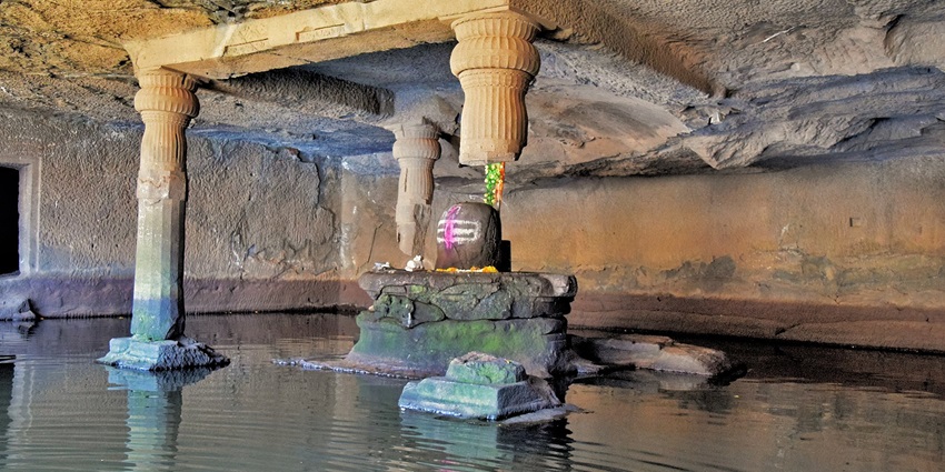 An image of a cave covered with massive rocks at a tourist place to visit near Akola.