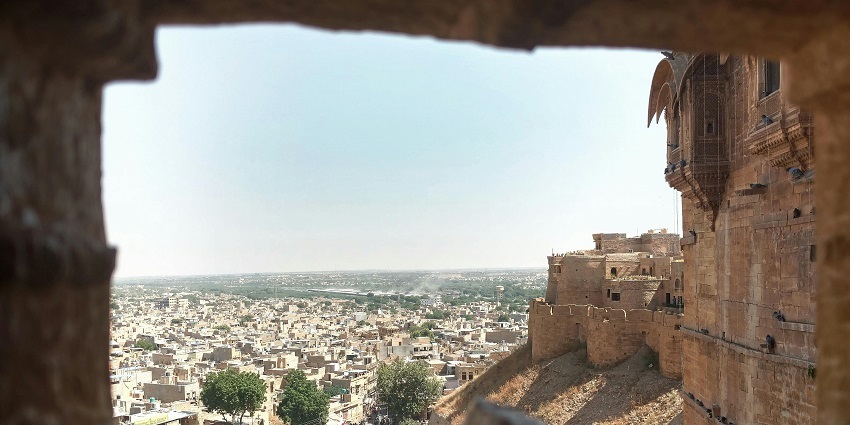 An image showing the ancient stone fortress and old city, a best place near Gorakhgad Fort