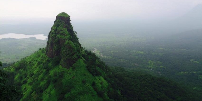 Machindragad Fort stands majestically amidst rugged hills and lush greenery