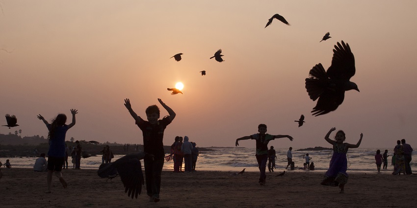 Children enjoying the sunset at Madh Island, a popular place near Kohoj Fort.
