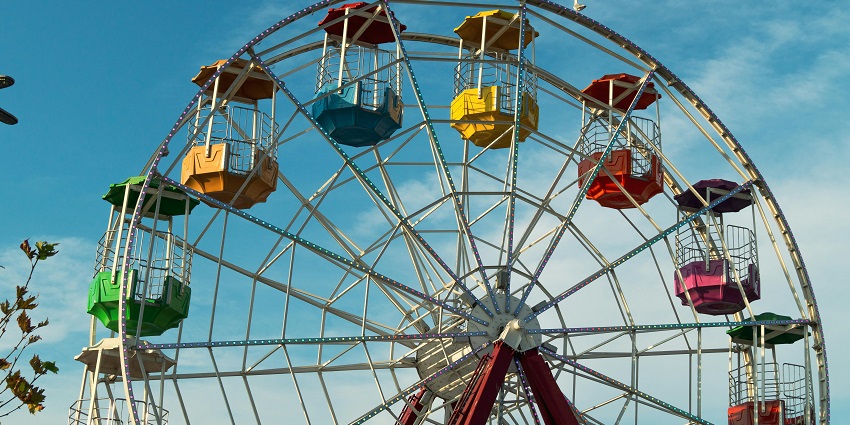 A glimpse of a colourful giant ferris wheel at the Magic Mountain, a top leisure hub.