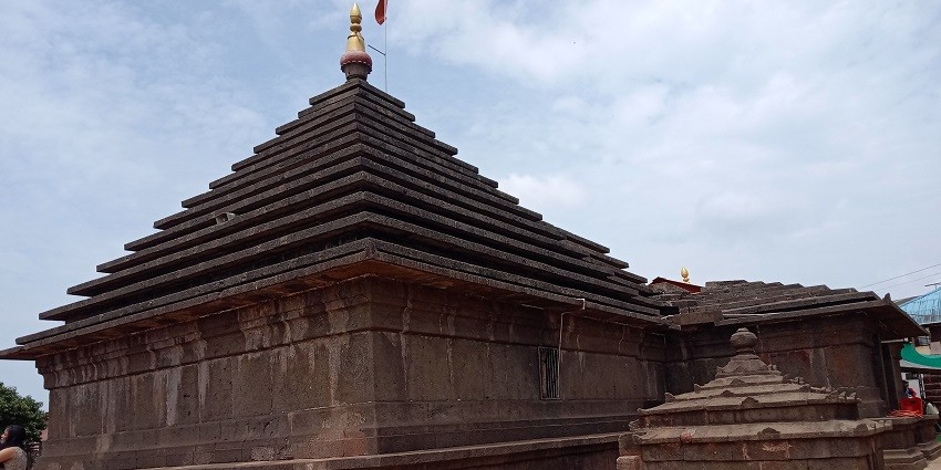 A view of an ancient temple dedicated to Lord Shiva, featuring intricate architecture.