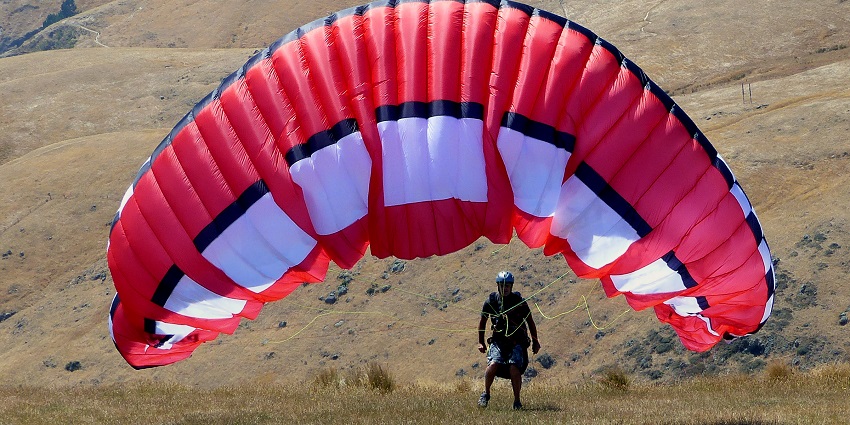 Paragliding in Chennai coastal town featuring ancient rock-cut temples and sculptures.