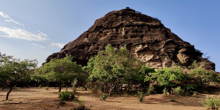 An image of Mahadeo Hill, featuring ancient temples and panoramic landscape views.