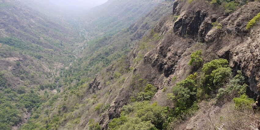 A scenic view of Mahadev Gad, showcasing lush greenery and stunning views all around.