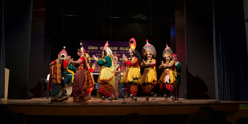 Group dancing in traditional gold and red attire, popular in places to visit in Mulund
