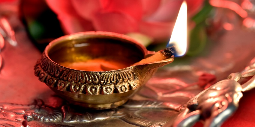 Image of a Close-up of a Lighted Diya in a temple - One of the best temples in Karjat