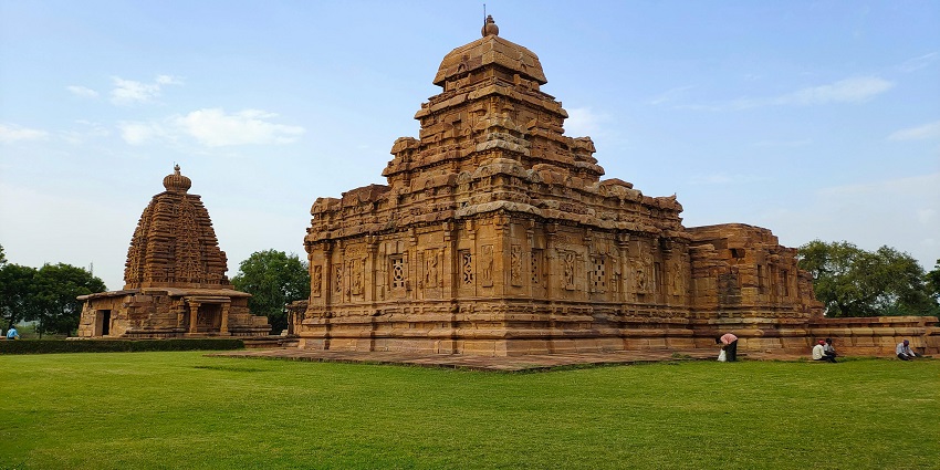 Temple with intricate architecture, lush surroundings and peaceful spiritual reflection.