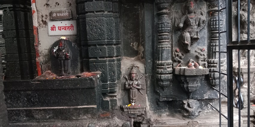 An insightful view of Mahalakshmi temple having a rock-cut sculpture of Lord Mahalakshmi.