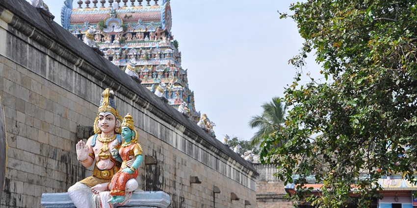 Stone corridor framed by gopuram of Mahalingeswarar Temple, Thiruvidaimarudur