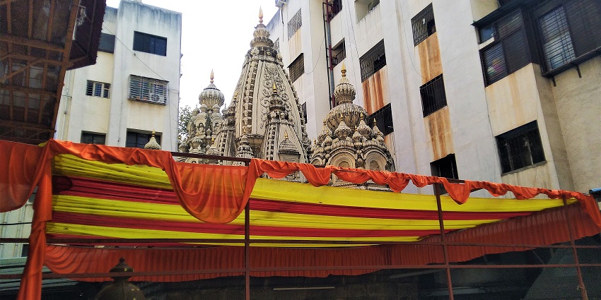 A picture of a historical temple in Pimpri Chinchwad with decorative tents in front of it