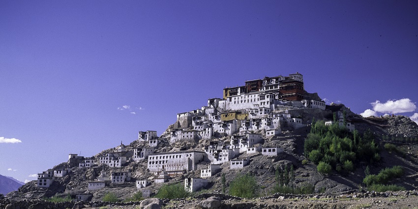 A picture of a monastery near the Chumthang Hot Spring with views of beautiful mountains