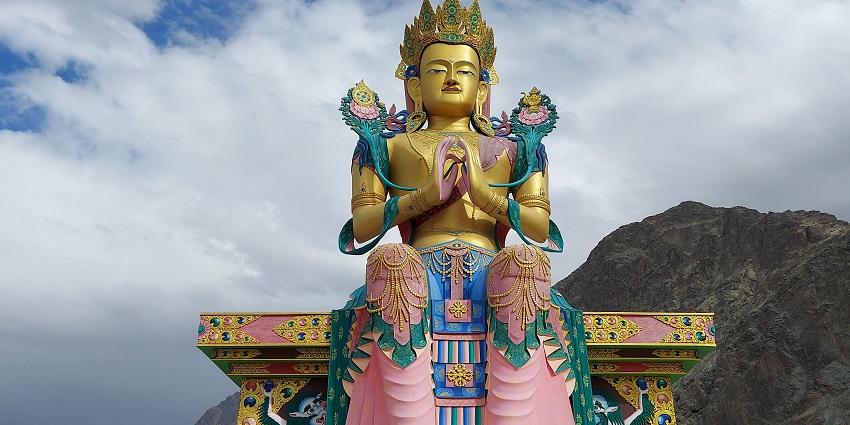 A tall Buddha statue located at the campus of the Diskit Monastery