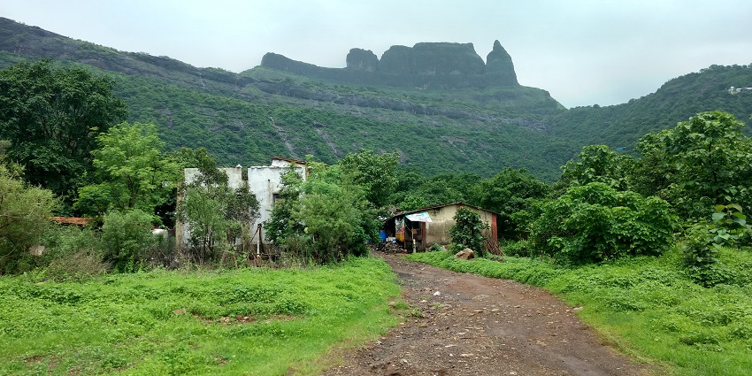 Stunning view of Malanggad from the valley, showcasing its majestic height and natural beauty