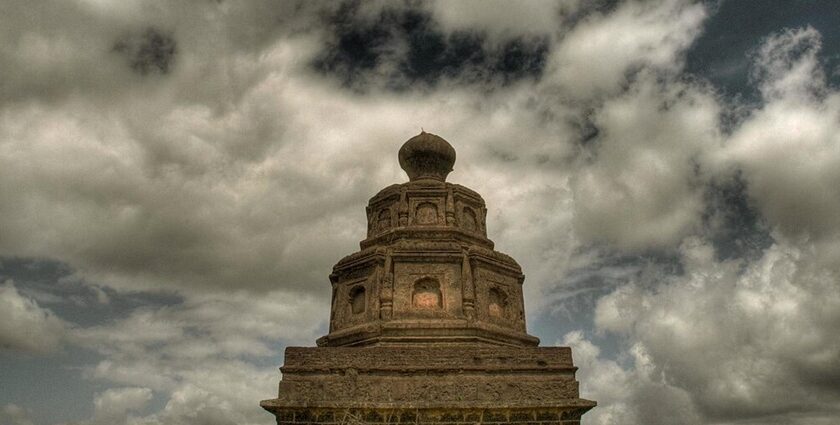 A view of Malhargad Fort, a scenic tourist attraction in Maharashtra, atop rugged terrain.