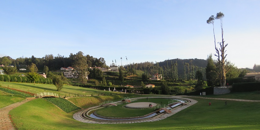 Malleshwaram Park features lush greenery, walking trails, and nature activities.
