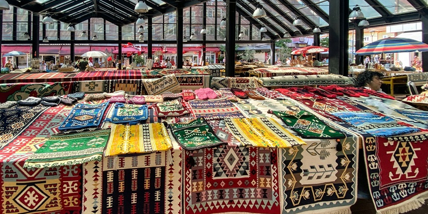 Malleswaram Market has a vibrant atmosphere with flowers, textiles, and street food.