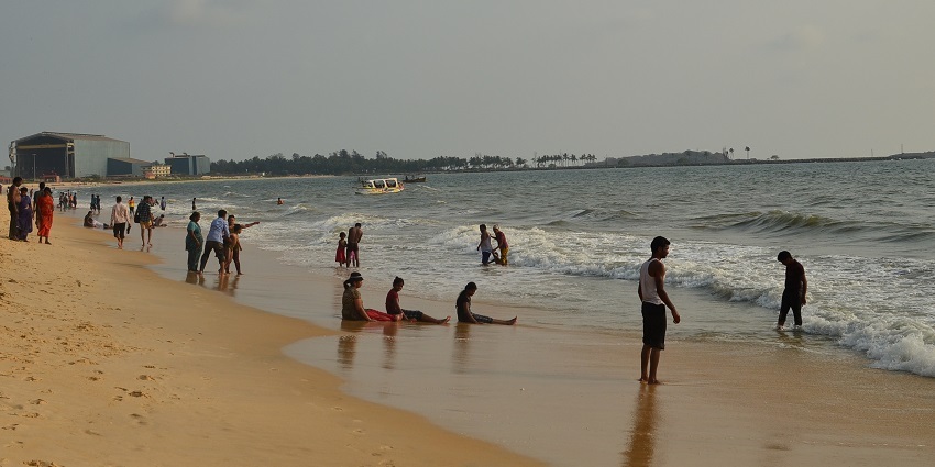 People enjoying at Malpe Sea Walk, a popular tourist attraction in Udupi.