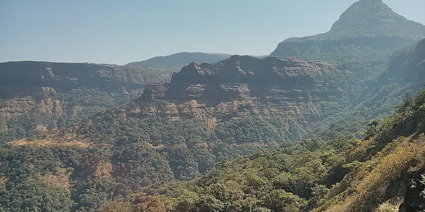 A view of greenery and mountains at Malshej Ghat near Manmodi Caves is perfect for tourists.