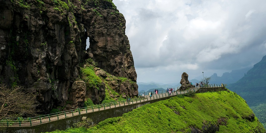 An image of Malshej Ghat with scenic mountain pass with waterfalls and biodiversity.
