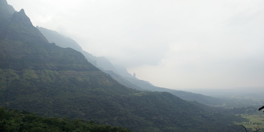 A scenic view of Malshej Ghat showing a top view of mountains in he landscape of Deccan