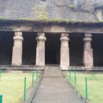 Panoramic view of the Mandapeshwar Caves showcasing ancient rock-cut architecture.