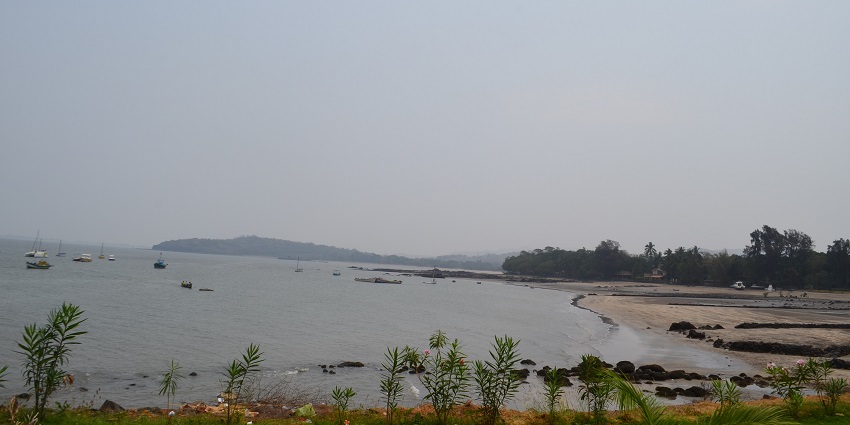 Mandwa Beach near Bankot Fort, showcasing sandy shores and blue waters
