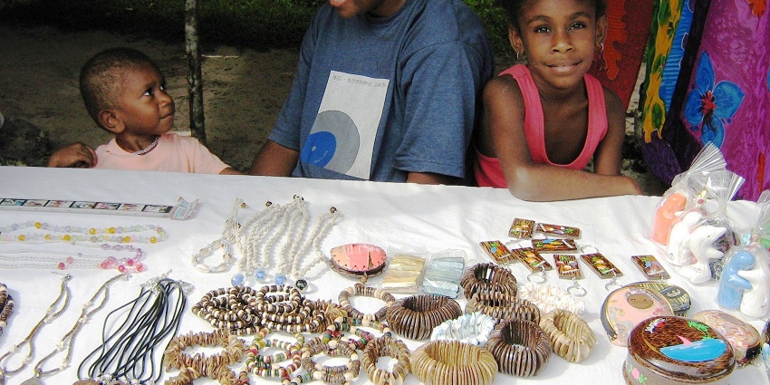 Choose from beach souvenirs on display while shopping in Alibaug at the Mandwa Jetty Market