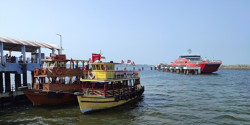 A scenic view of colourful ferry boats on serene waters at Mandawa sporting PWPI flags.