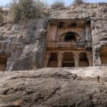 Manmodi Caves in Junnar featuring ancient rock-cut architecture with intricate carvings.