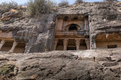 Manmodi Caves in Junnar featuring ancient rock-cut architecture with intricate carvings.