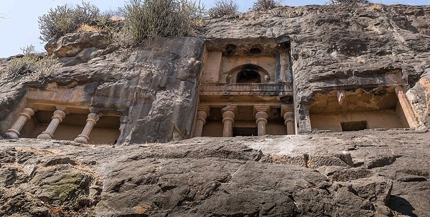 Manmodi Caves in Junnar featuring ancient rock-cut architecture with intricate carvings.