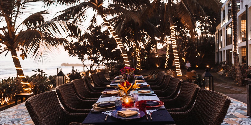 View of a dining table at Manori Beach, a charming destination for relaxation and leisure