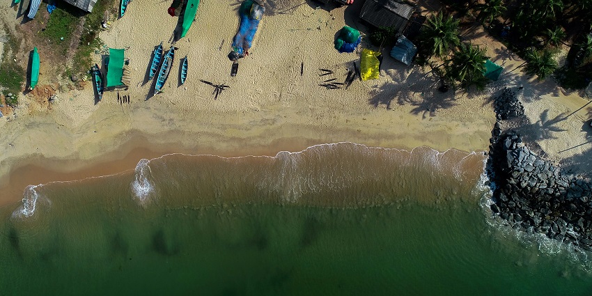 A scenic view of Maravanthe beach, showcasing golden sands, gentle waves for travellers.