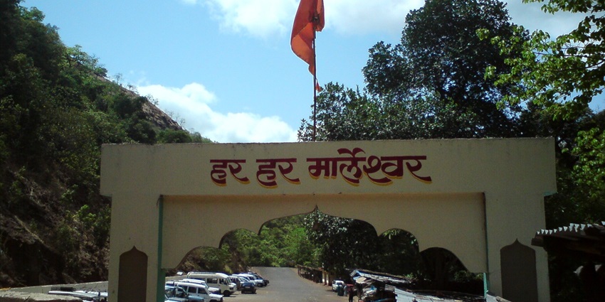The Marleshwar Temple is an old shrine surrounded by lush greenery with a calm atmosphere.