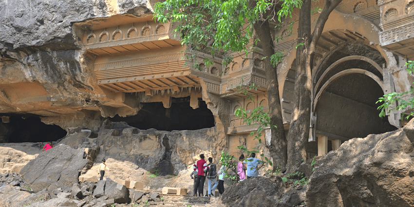 Ancient rock-cut Kondana Caves with intricate carvings nestled in the hills near Khopoli.