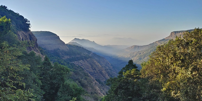 A breathtaking vista of green-capped mountains and lush greenery of the serene Matheran.