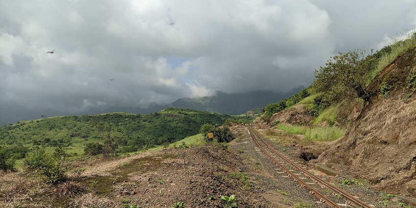 An image of the toy train winds through the lush hills of Matheran, among the charming places to visit near Pune for couples.
