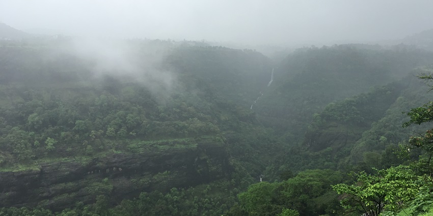 Panoramic view of Matheran hills covered by lush green trees and cascading hills