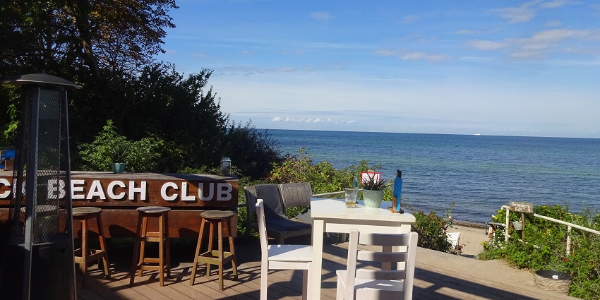 Scenic beach club offering relaxation, dining, and beautiful views