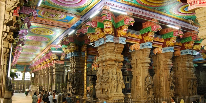 Intricate carvings and sculptures at the entrance of Madurai Meenakshi Amman Temple.