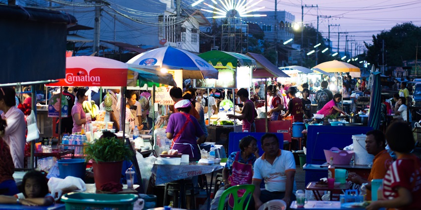A street brimming with fancy food stalls offering sizzling and delicious food in Indore.