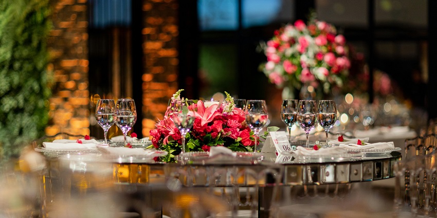 A view of a beautifully decorated table with centrepieces at the Minakshi Conventions.