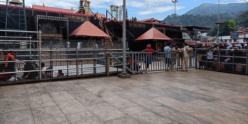 The temple of Sabarimala with devotees lined up outside waiting for their turn to pray.
