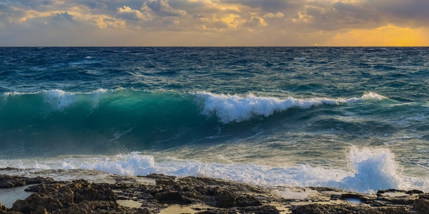 Mirjan Fort Beach is a serene beach scene featuring gentle waves lapping shore, one of the best beaches near Honnavar.