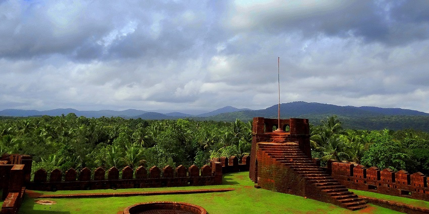 Places to visit in Kumta include Mirjan Fort's ancient stone walls surrounded by greenery.